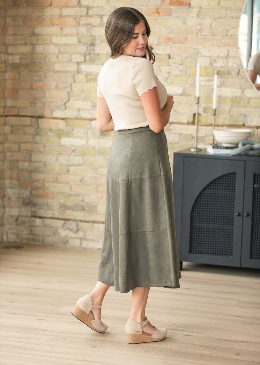 Back view of olive faux suede A-line midi skirt with clean, flattering silhouette.
