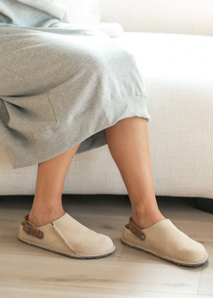 Suede clogs paired with a hoodie dress