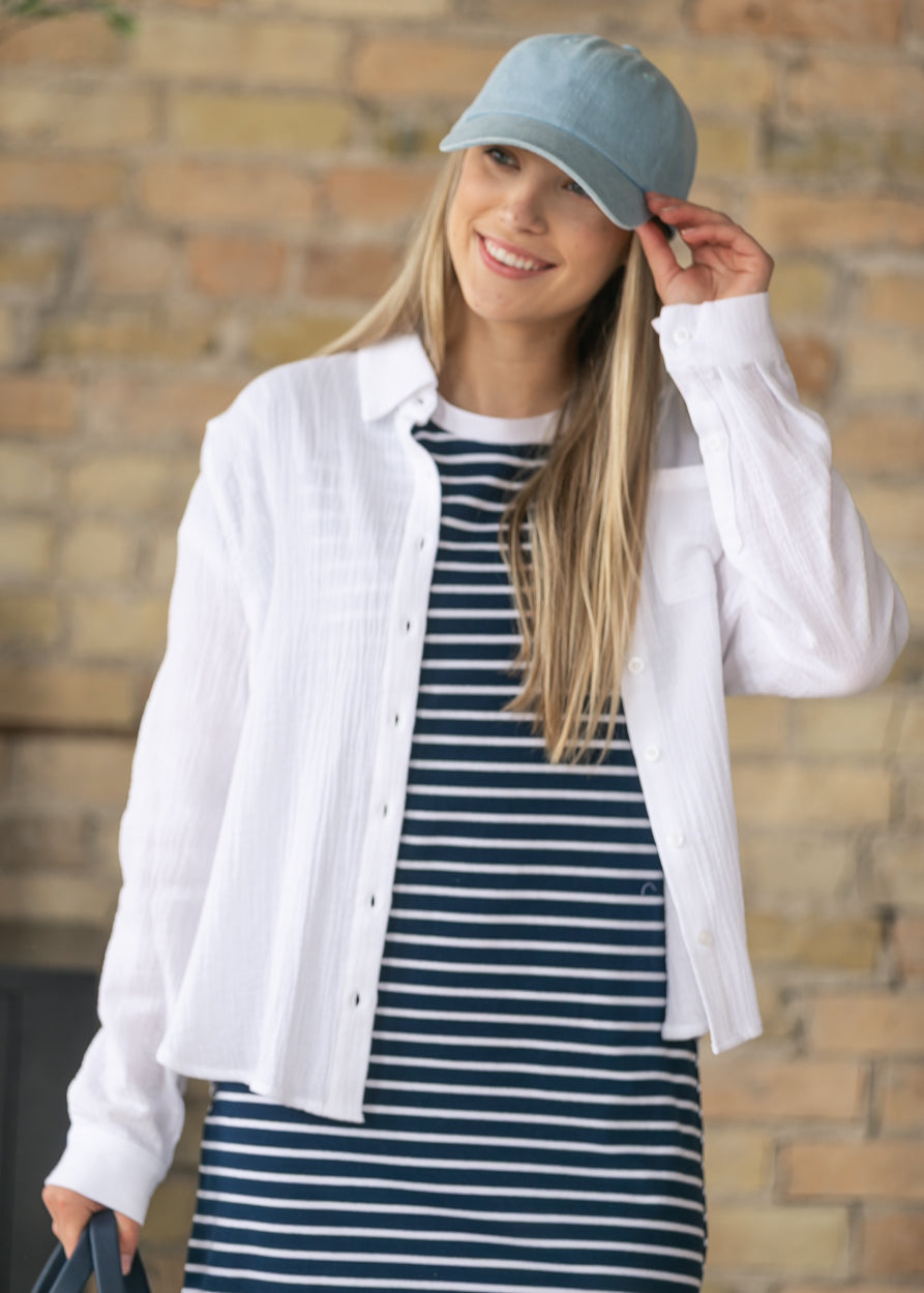 Casual striped midi dress layered with a white gauze button-down shirt