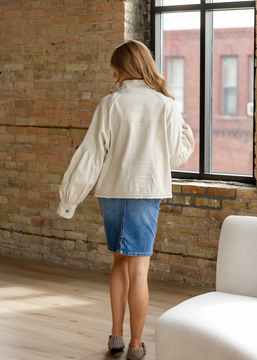 Back of cream twill jacket showing the oversized silhouette, dropped shoulders, and balloon sleeves.