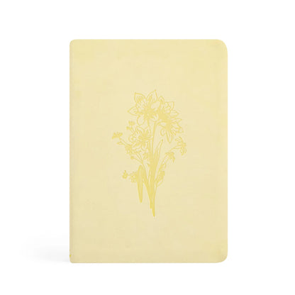 Butter-yellow Hosanna Revival Belfast notebook front cover and spine with a gold daffodil bouquet design.