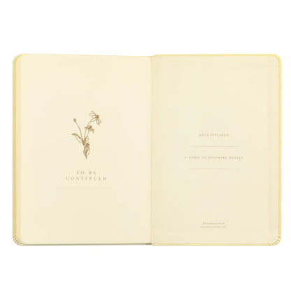 Belfast notebook opening pages with a gold daffodil sketch, a date started prompt, and a "the notebook of" nameplate.