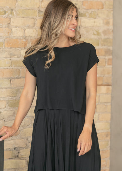 Black two-piece set featuring a flowy maxi skirt and relaxed top