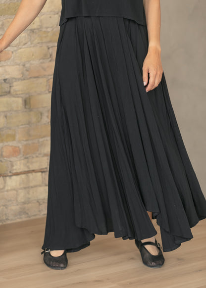 Close view of black maxi skirt with hidden side pocket detail