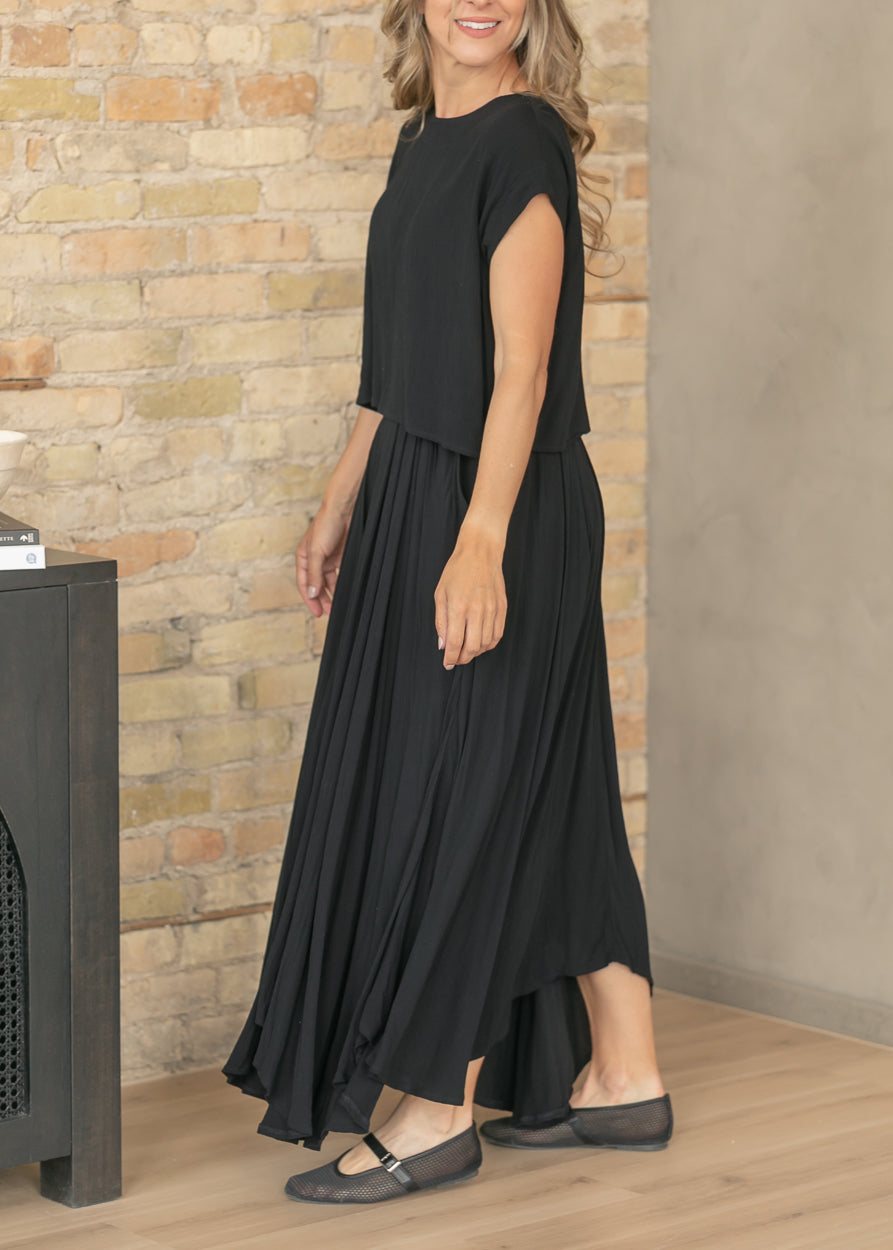 Black two-piece set featuring a flowy maxi skirt and relaxed top