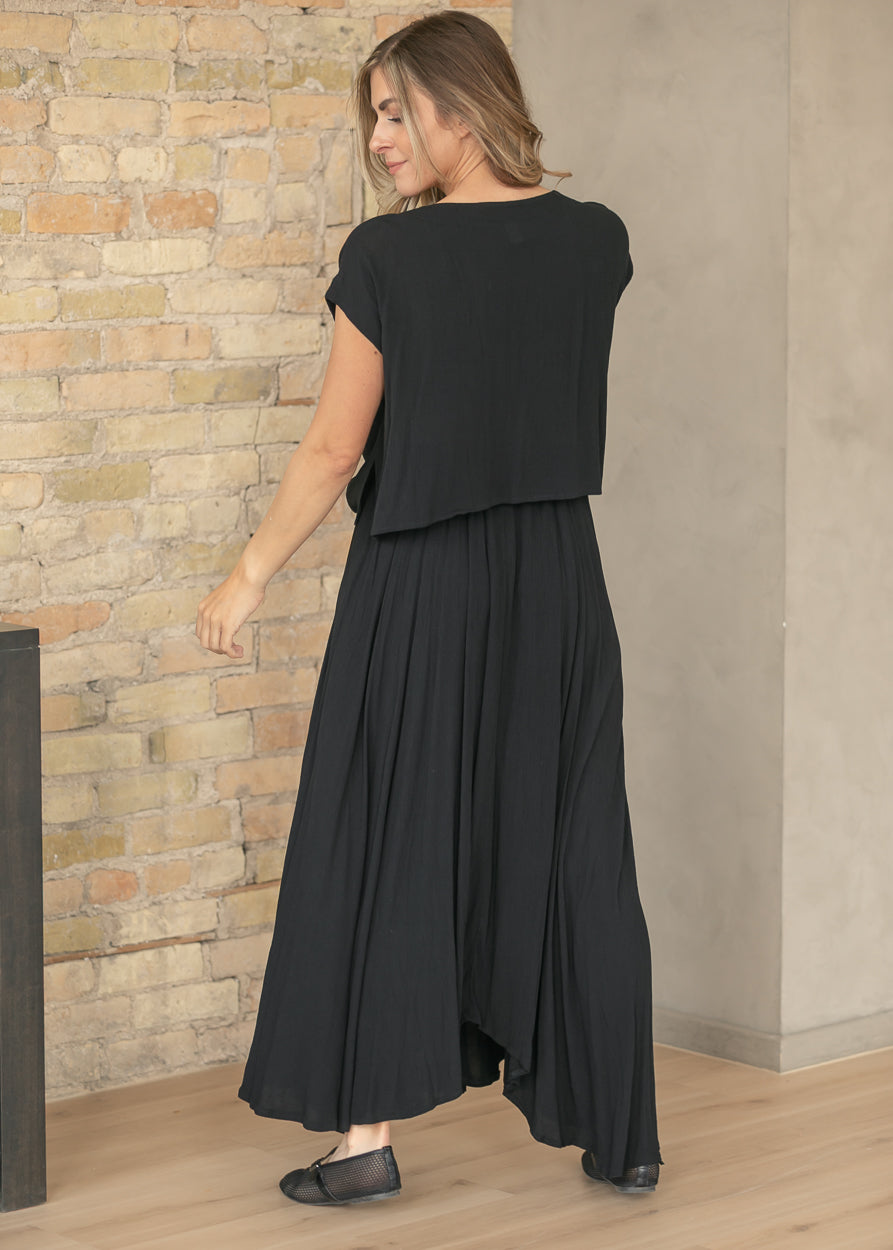Back view of black matching skirt set with layered cropped top