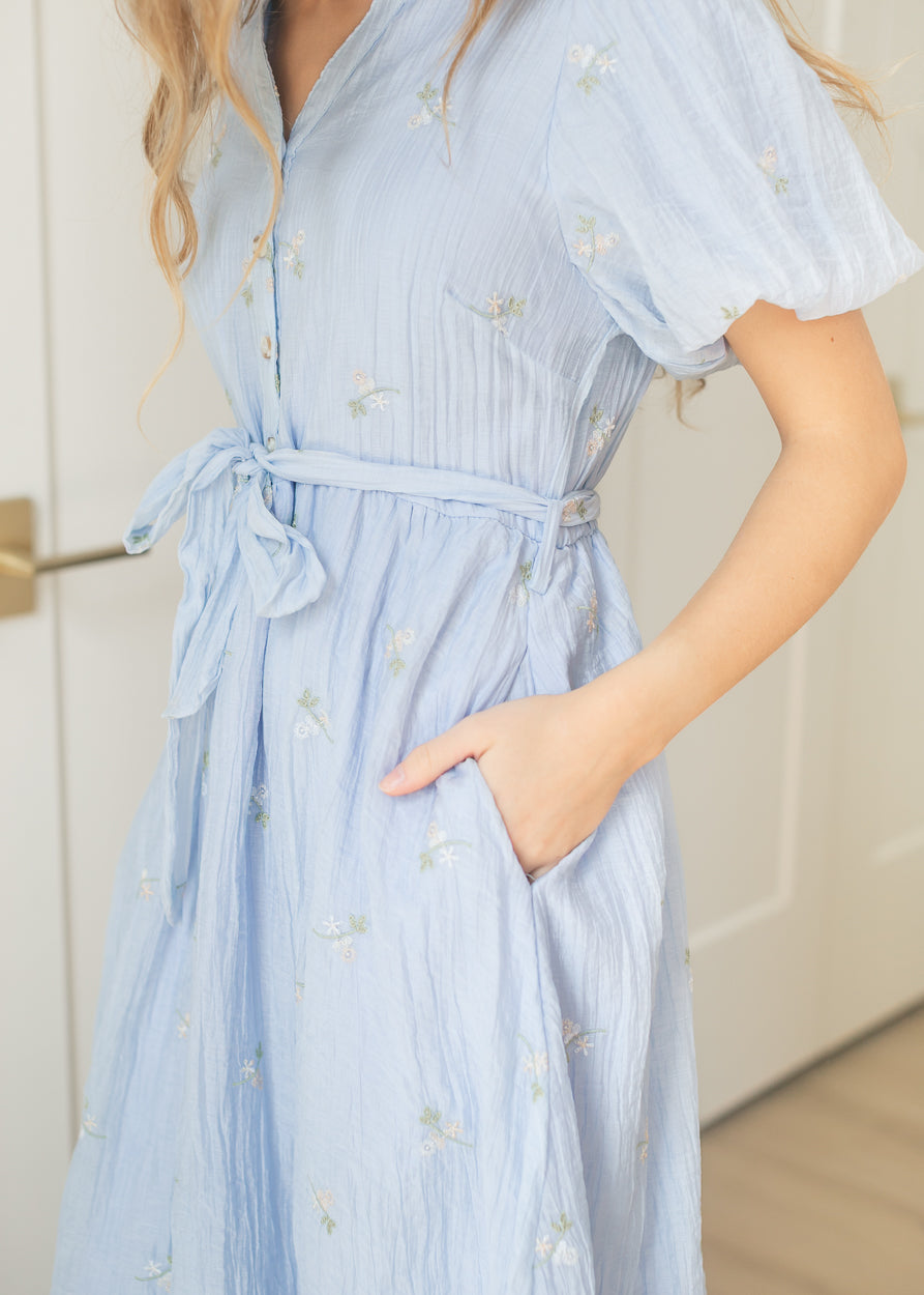 Blue floral embroidered dress with functional buttons and side pockets