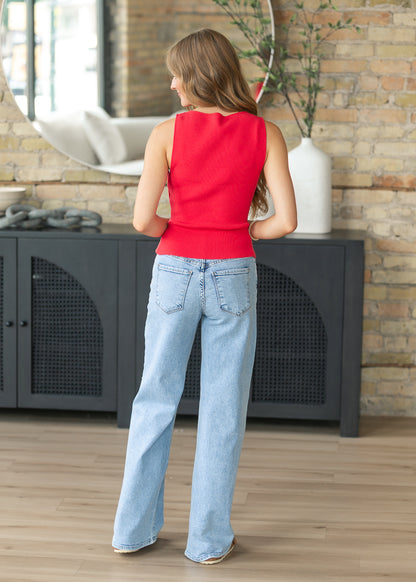 Back view of light wash high rise wide leg denim jeans showing five-pocket design.