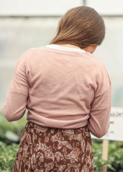 Back view of mauve lightweight cardigan with sheer knit detail and ribbed hem