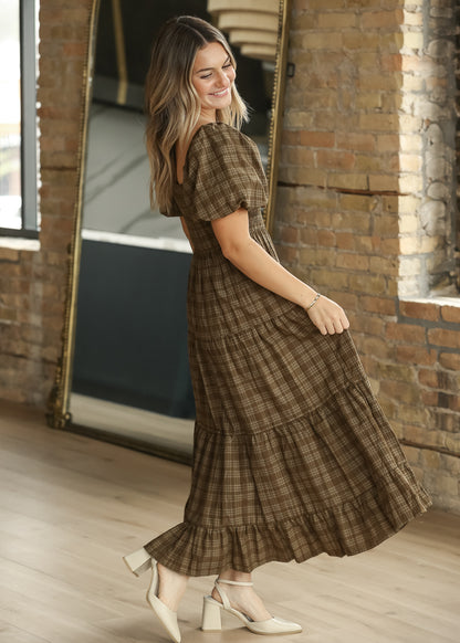 Brown plaid square neck midi dress with smocked bodice, puff sleeves, and tiered skirt.