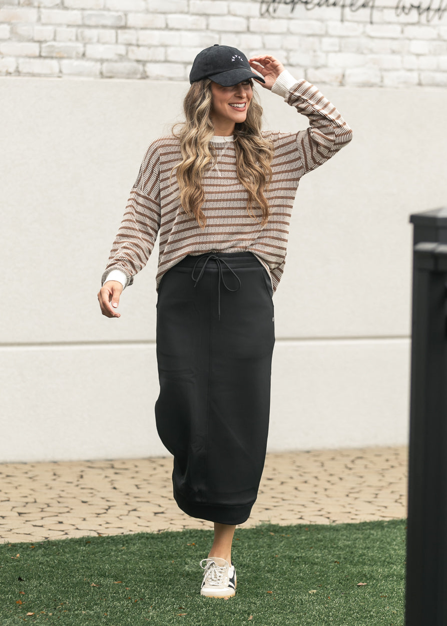 Brown and cream ribbed round neck pullover top with contrast neckline and cuffs.