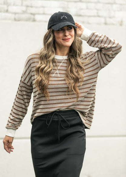 Brown and cream ribbed round neck pullover top with contrast neckline and cuffs.