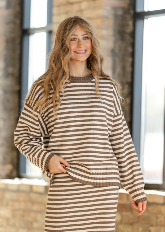 Campus Striped Ivory Knit Sweater with brown horizontal stripes, dropped shoulders, and long sleeves.
