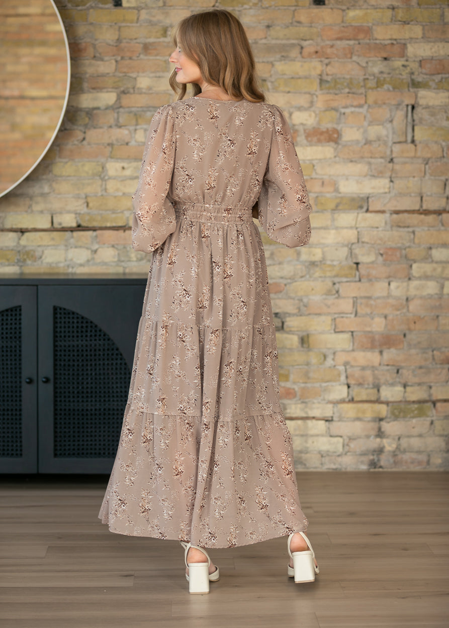 Back view of Celia brown floral maxi dress showing the ankle-length skirt and gathered waist.