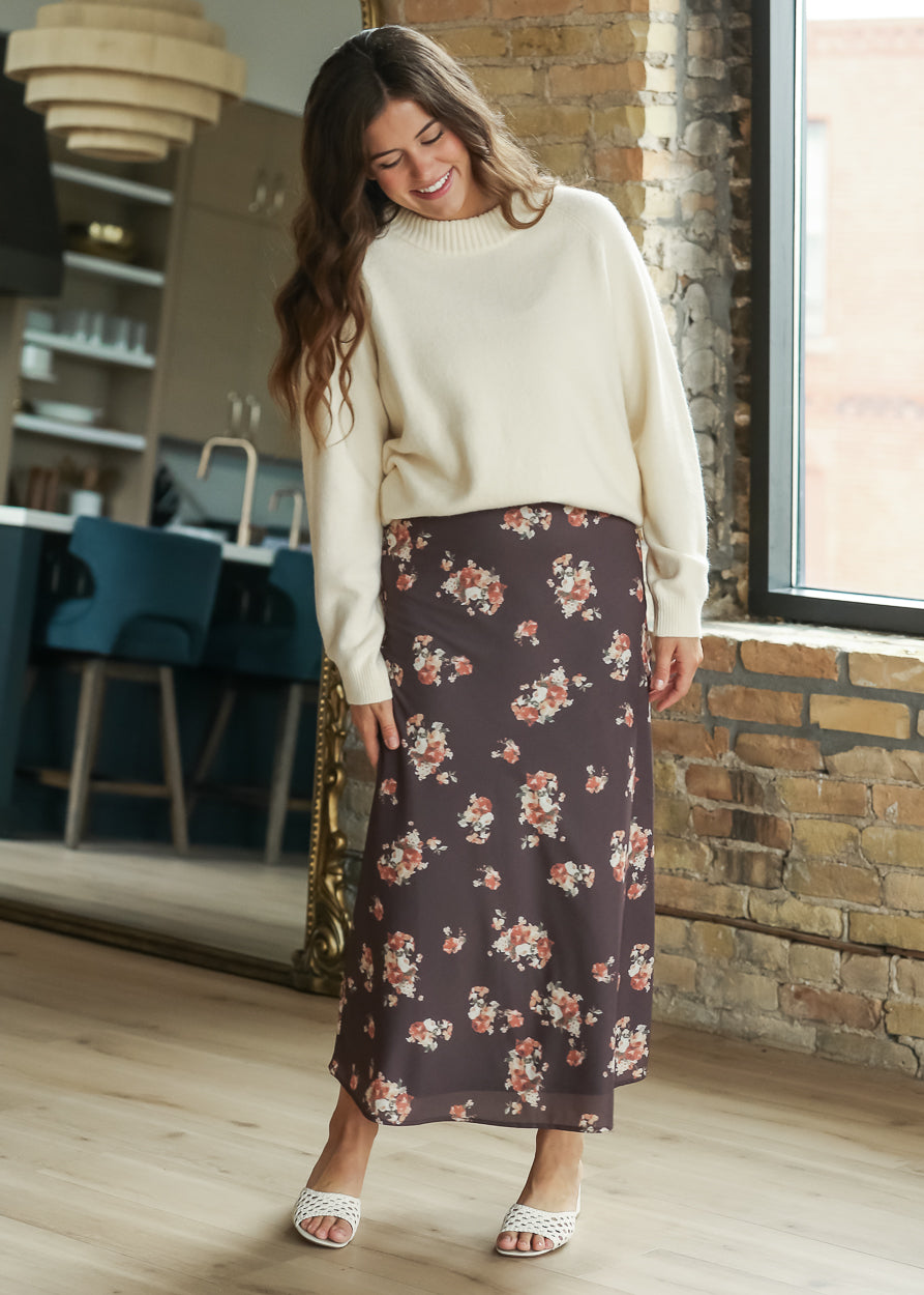 Charcoal multi floral midi skirt with a semi-fitted shape and ankle-length hem