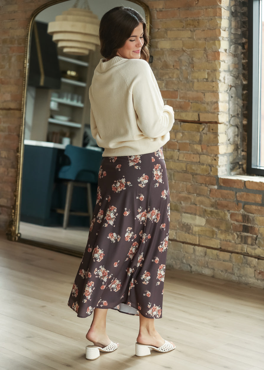 Back view of charcoal multi floral midi skirt showing the flowy ankle-length silhouette