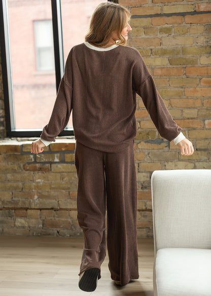 Back of chocolate ribbed top and wide-leg pants showing oversized fit and relaxed silhouette.