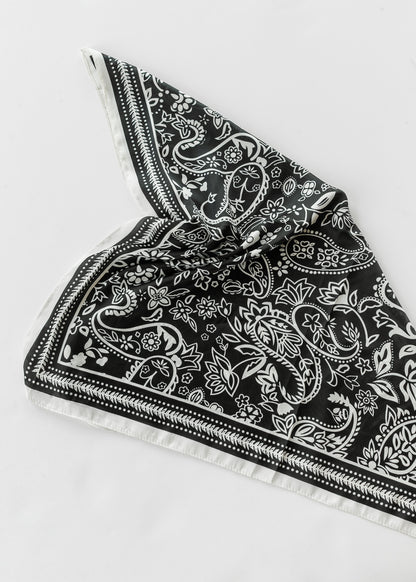 Folded Classic Black Paisley Satin Scarf displaying the black and white paisley print and satin finish.