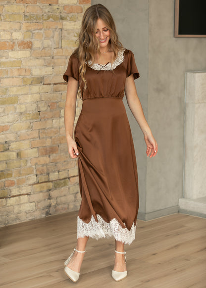 Chocolate brown short sleeve midi dress with contrast cream lace trim and a defined waist.