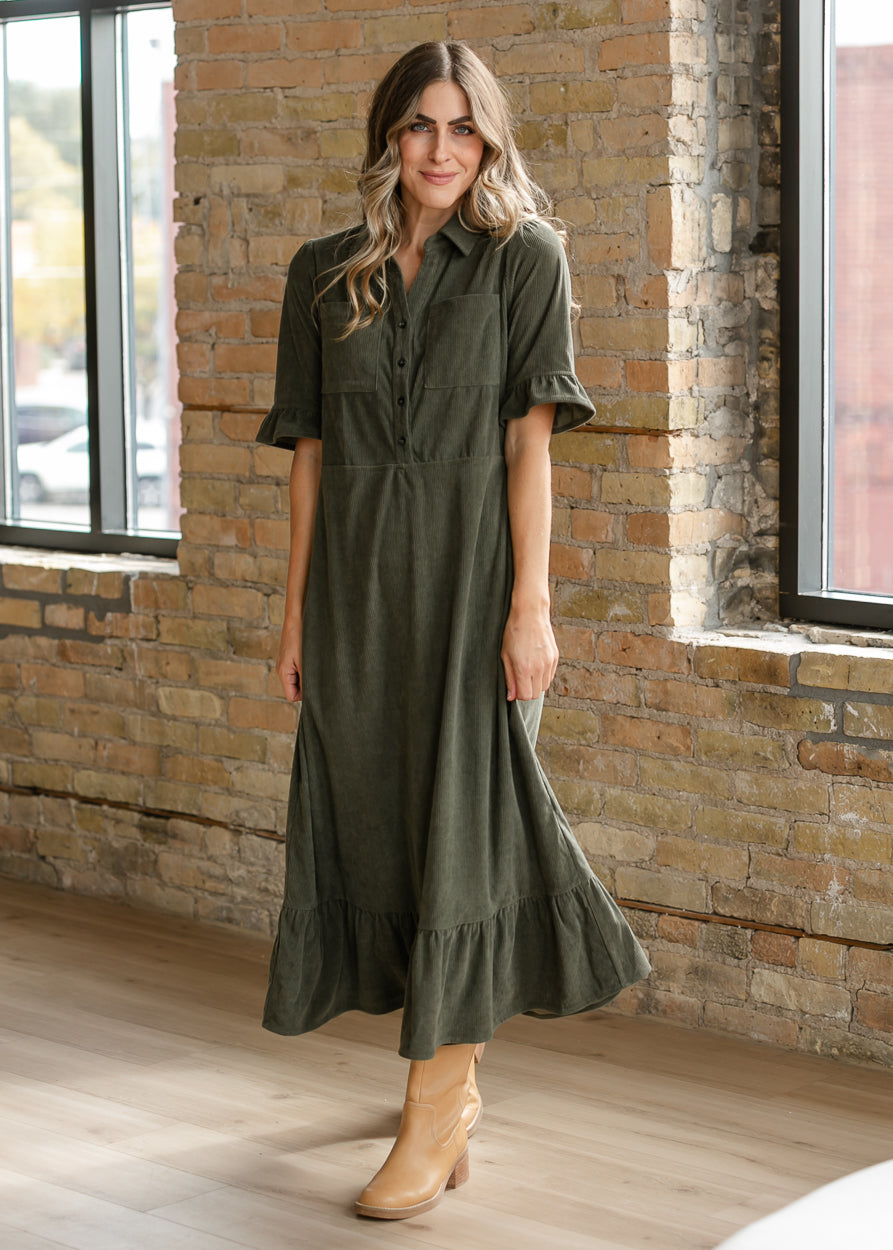 Olive half sleeve corduroy midi dress styled with tan ankle boots for a fall outfit.