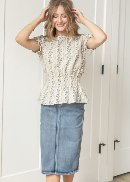 Cream woven top with delicate blue floral pattern