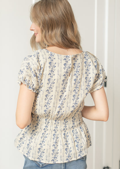 Floral peplum blouse styled with a light wash denim skirt