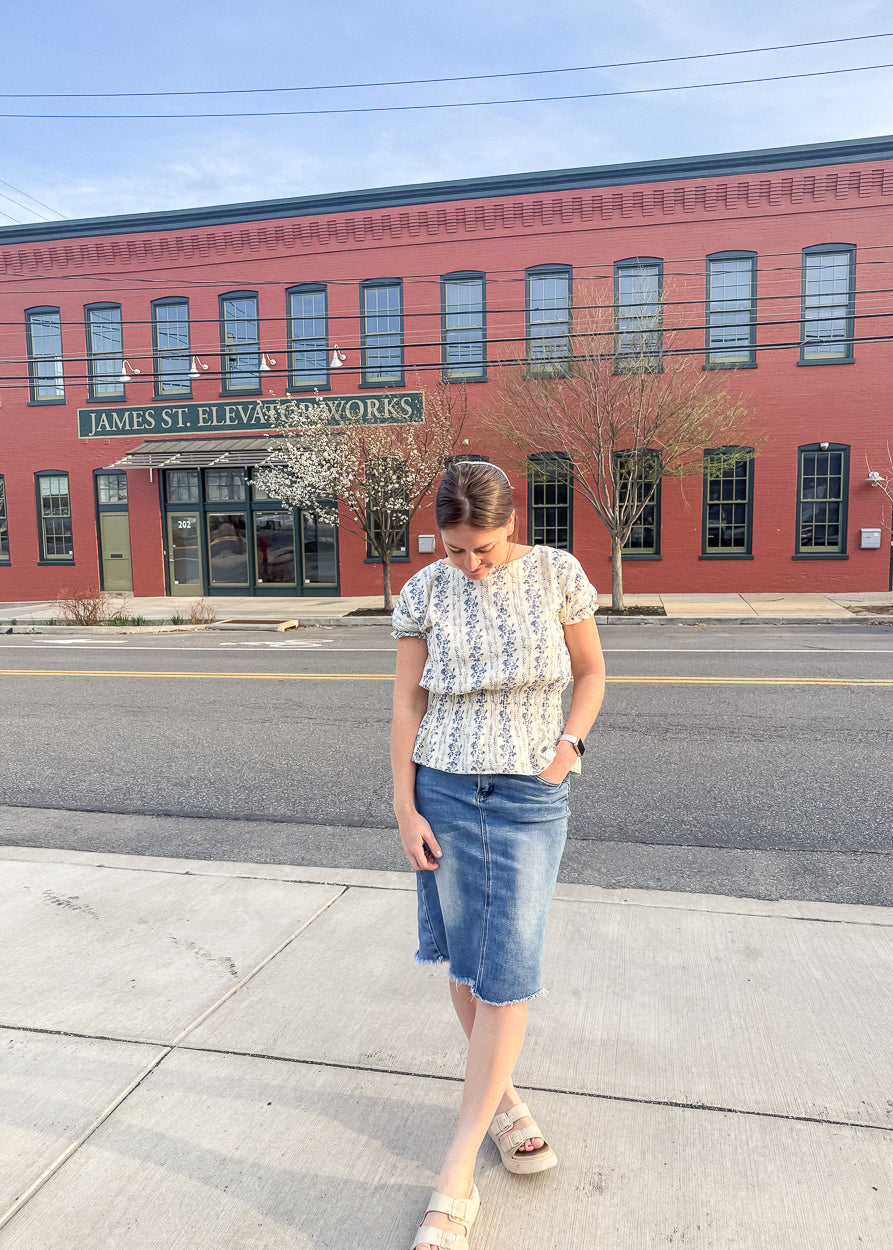 Cream floral peplum top with blue vintage-inspired floral print