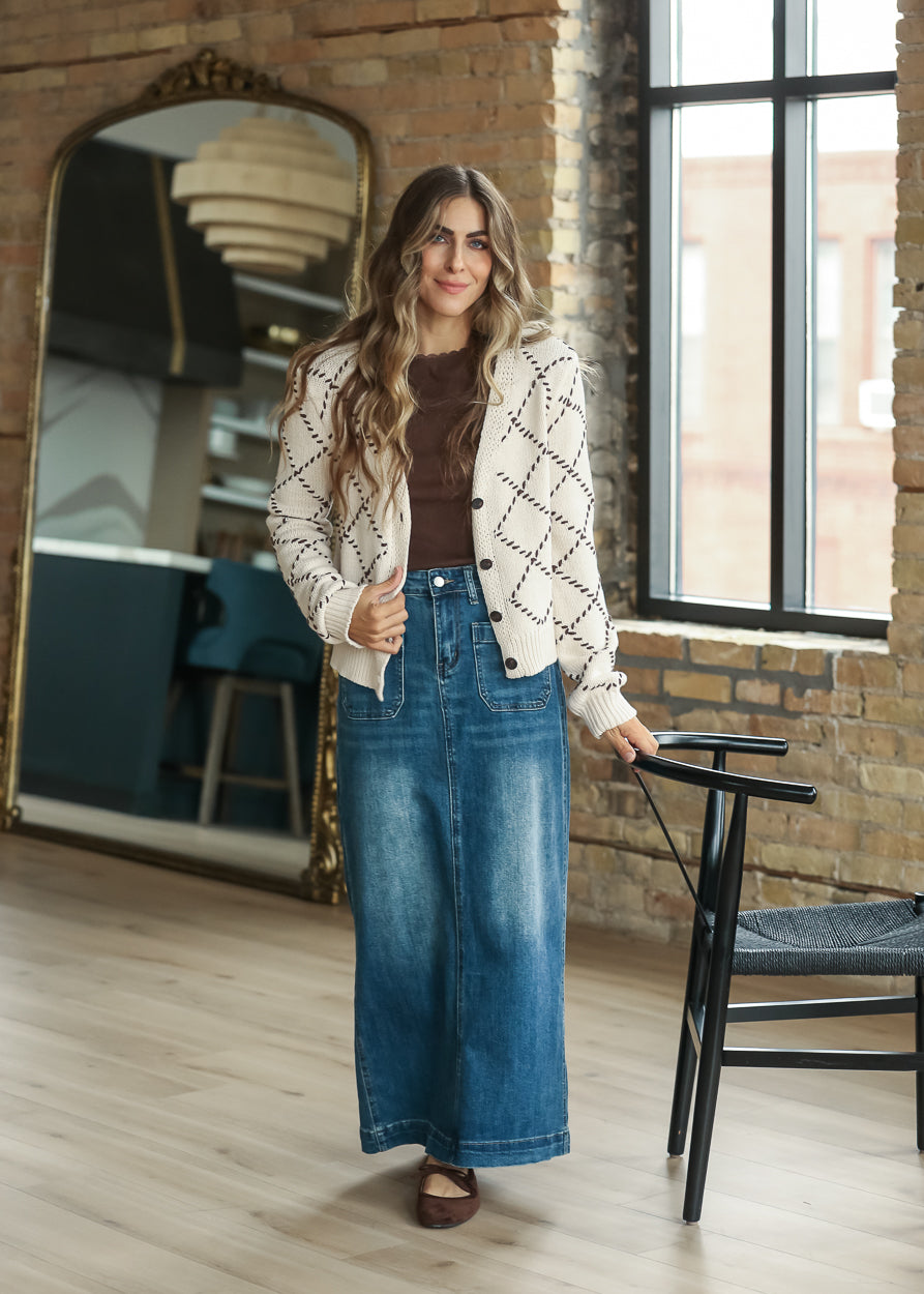 Full-length cream diamond stitch cardigan outfit with denim maxi skirt.
