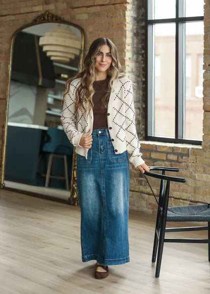 Full-length cream diamond stitch cardigan outfit with denim maxi skirt.
