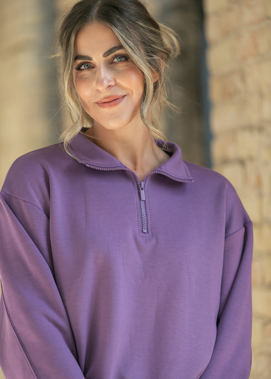 Dusty purple quarter-zip mock neck sweatshirt with ribbed collar and zipper, close front view.