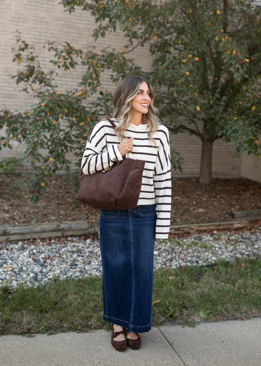 Striped Piper cardigan styled with a denim maxi skirt, suede tote, and mary jane flats.