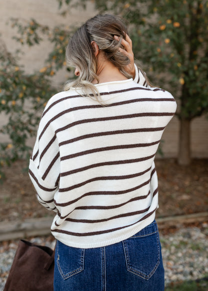 Back of the striped Piper cardigan showing its relaxed, drop-shoulder fit and ribbed hem.
