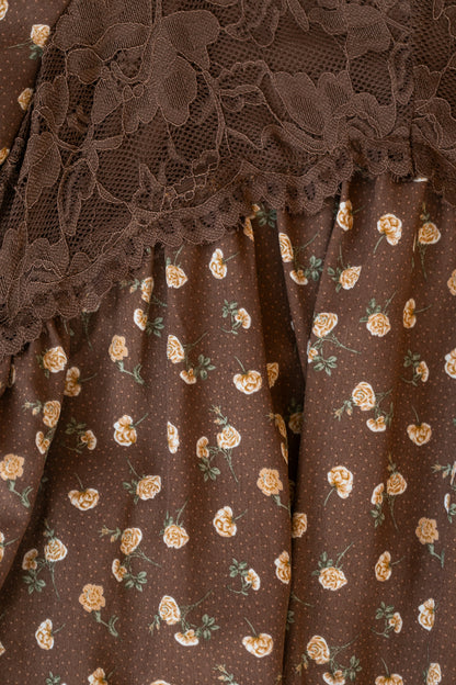 Close-up of tonal brown floral lace trim above the small cream rose print on the Elise maxi dress.