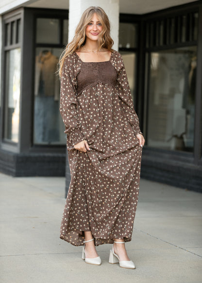 Full-length Elise brown floral maxi dress with lace bodice, square neckline, and gathered skirt.