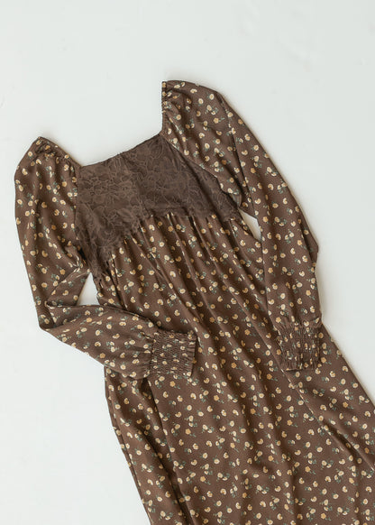 Flat lay of the Elise brown floral maxi dress showing the lace bodice, square neckline, and smocked cuffs.