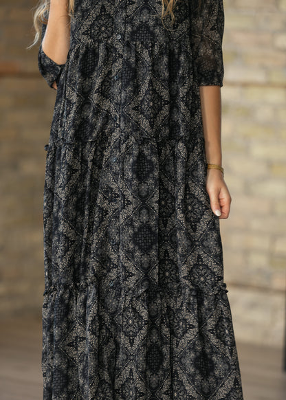 Side view of black and cream Elsie dress showing the half sleeve and A-line silhouette.