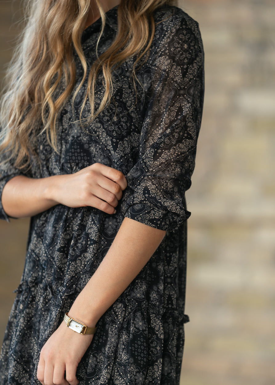 Close-up of Elsie paisley midi dress showing the half sleeve and printed fabric.