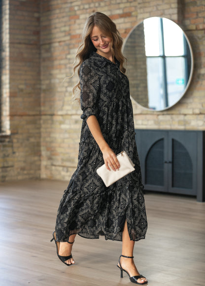 Elsie paisley dress in motion showing the tiered midi skirt.
