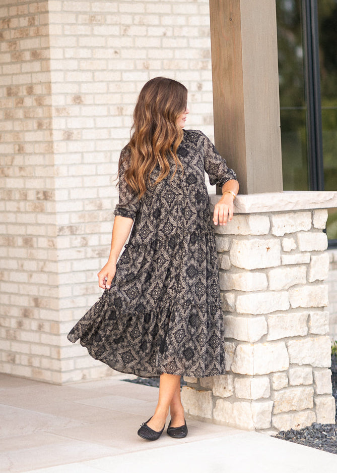Black and cream paisley Elsie midi dress with half sleeves, button front, and tiered skirt.