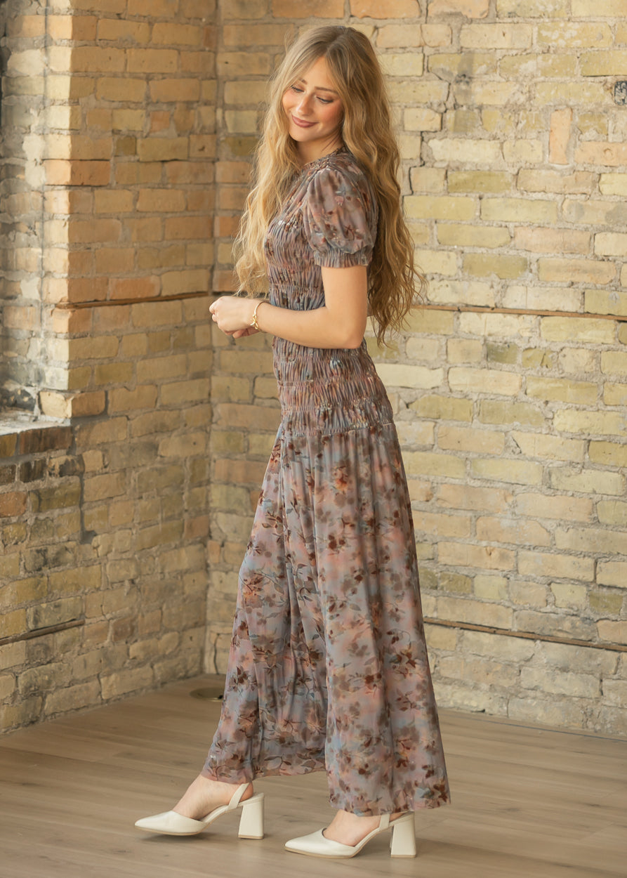 Muted mauve floral maxi dress styled with cream block heels, shown from the side at ankle length.