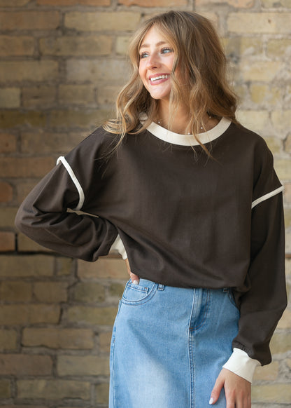 Espresso cotton crewneck sweater with drop shoulders, cream trim, and oversized silhouette.