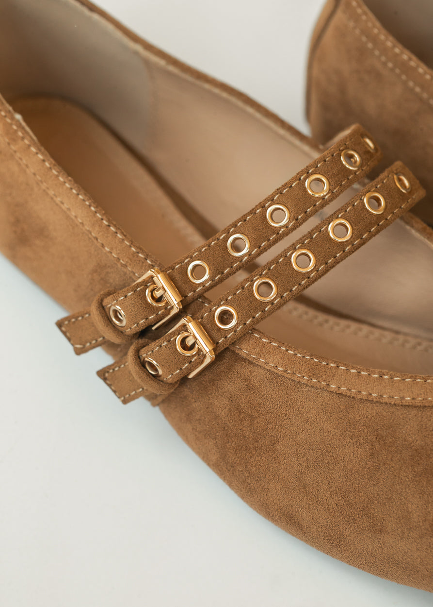 Close-up of Corkys faux suede double straps with gold-tone buckles and eyelet details.