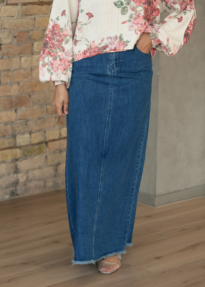 Medium-wash Elisha denim maxi skirt with ankle-length silhouette and functional front pockets.