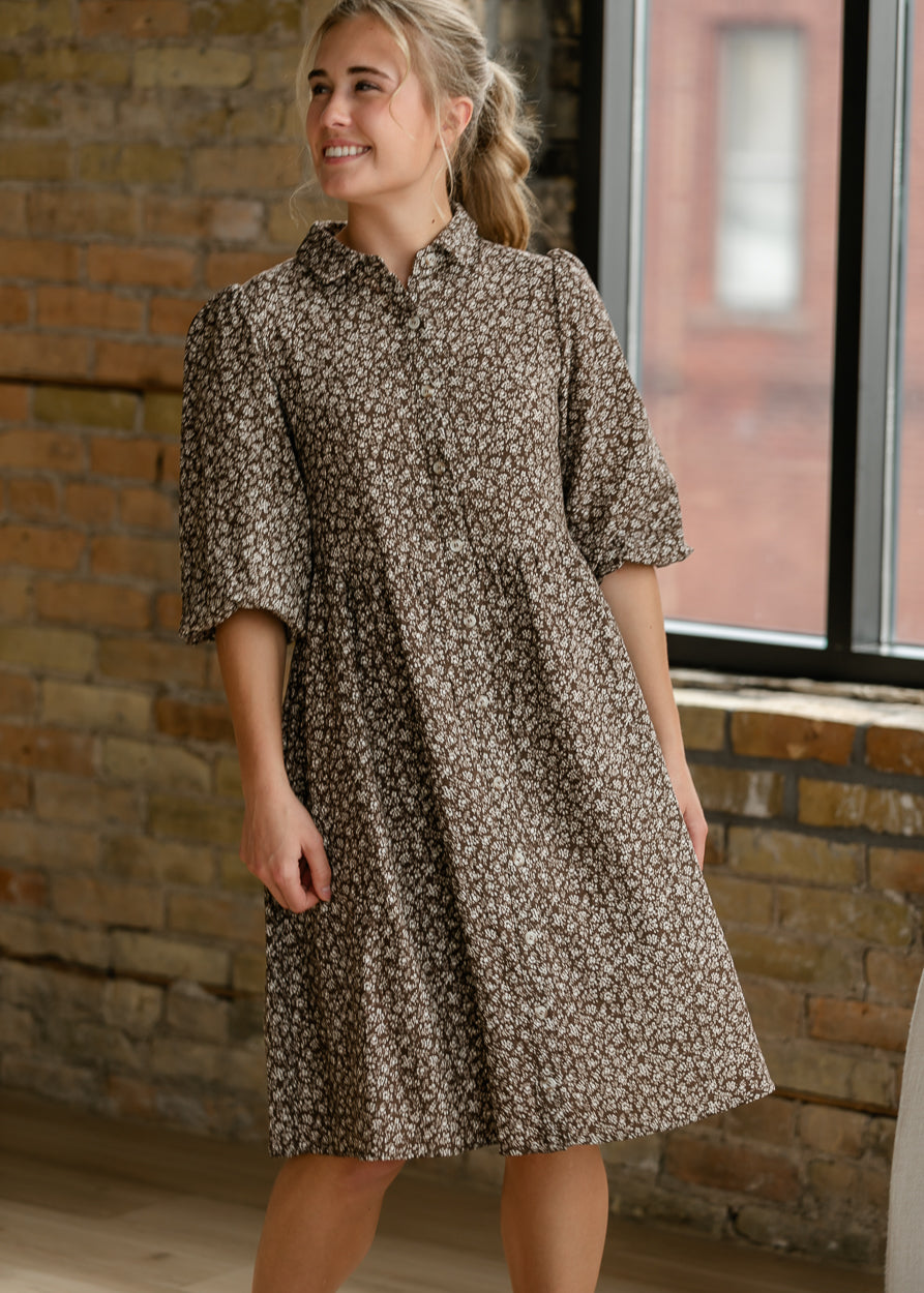 Brown floral button-up dress with collared neckline and petite cream print.