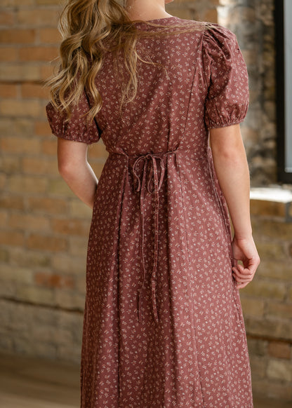 Brown floral midi dress styled with cream woven flats for an easy everyday look.