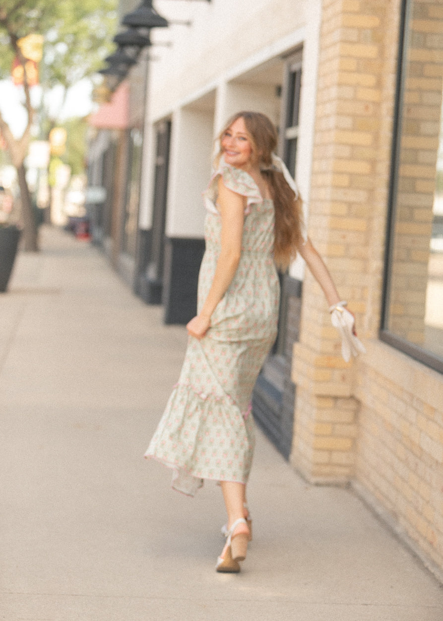 Feminine floral maxi dress with tiered skirt