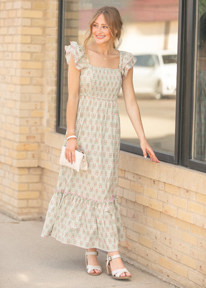 Floral smocked bodice maxi dress with pink trim accents