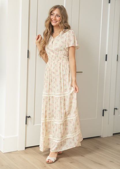Ivory floral maxi dress with flutter sleeves and smocked waist