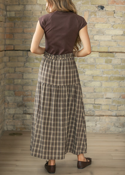 Back of brown plaid maxi skirt showing the gathered waist and full ankle-length silhouette.