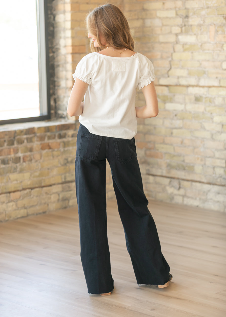 Back view of Free People black boyfriend jeans showing relaxed fit and rear pockets